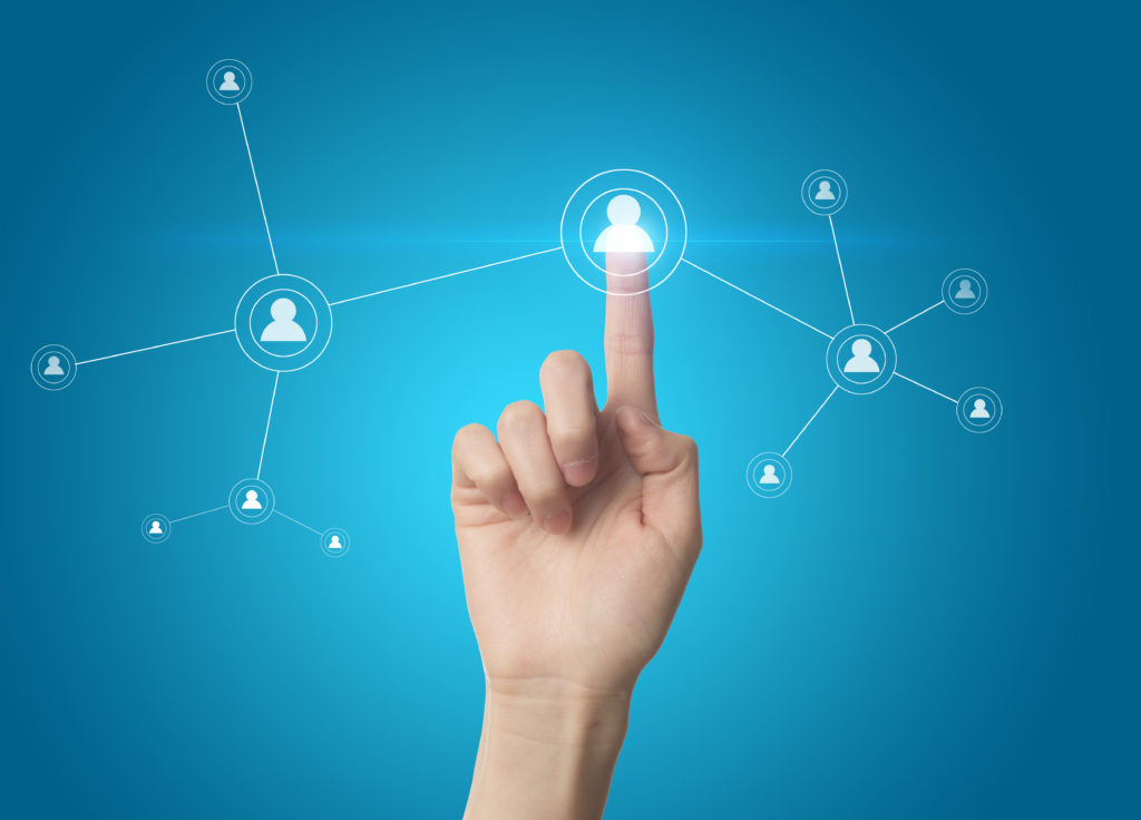 finger pointing to silhouette of person in connected web of people