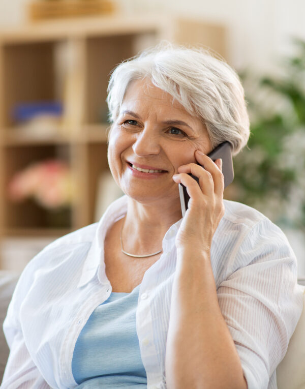 older woman on smartphone talking with remote pharmacist