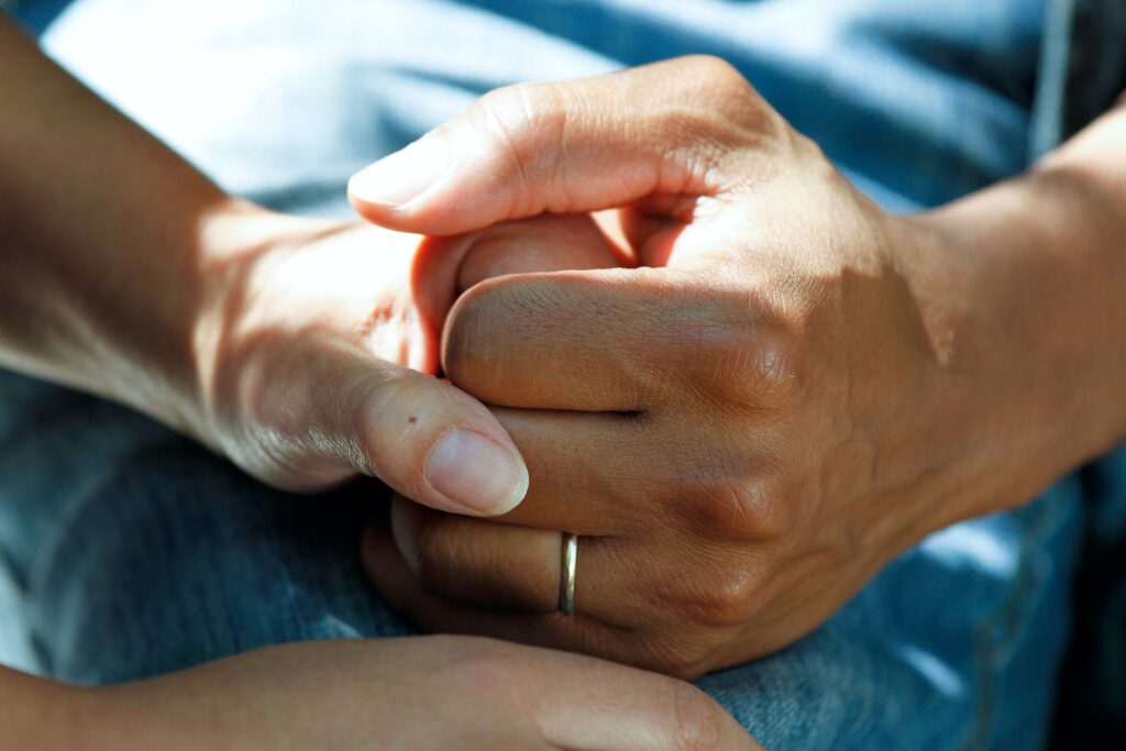 hands holding to symbolize the pharmacist patient relationship